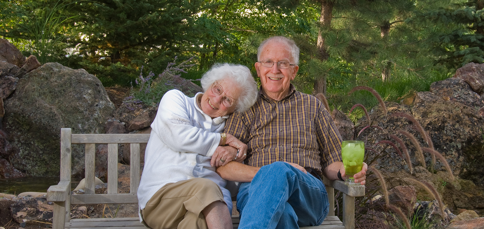 Elderly couple enjoying each other's company in nature.