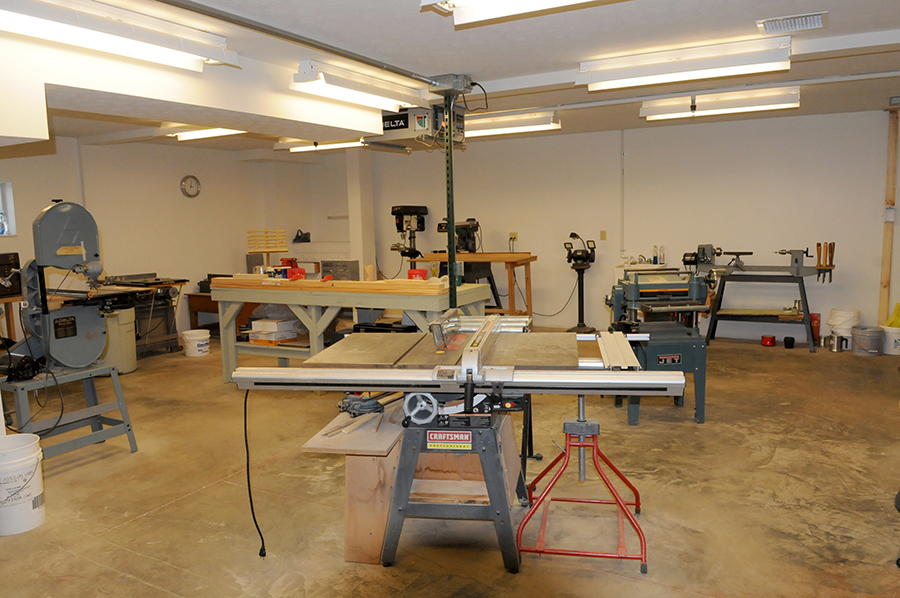 Well-equipped workshop with various tools and machinery.