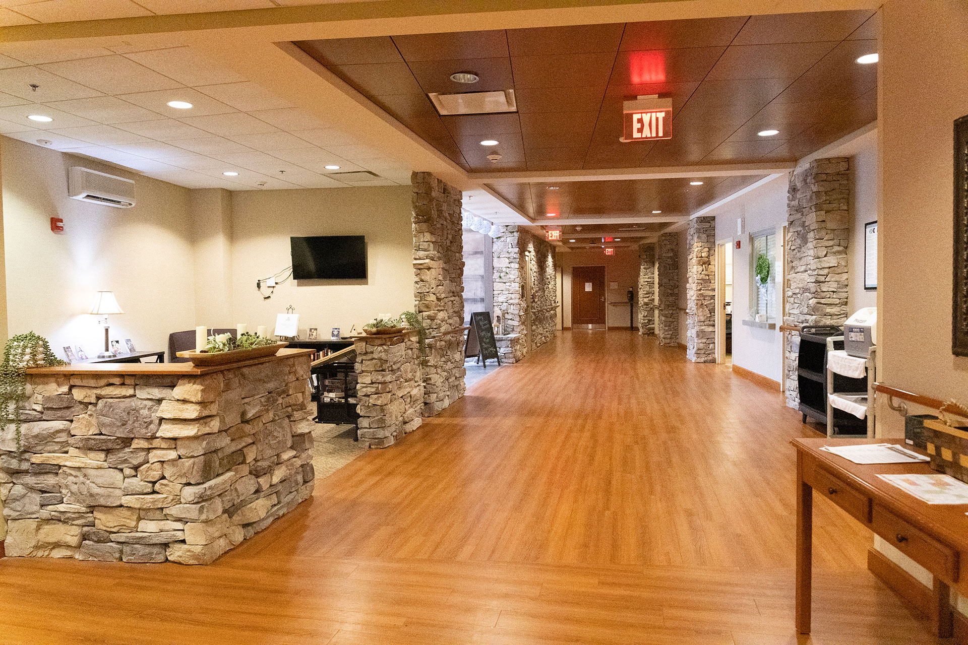 Spacious interior with stone walls and wooden flooring.