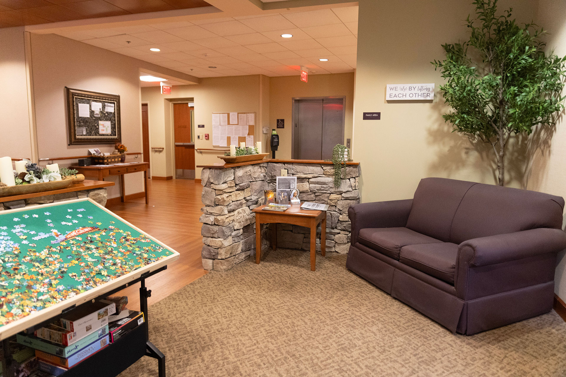 Cozy waiting area with puzzles and a comfortable couch.