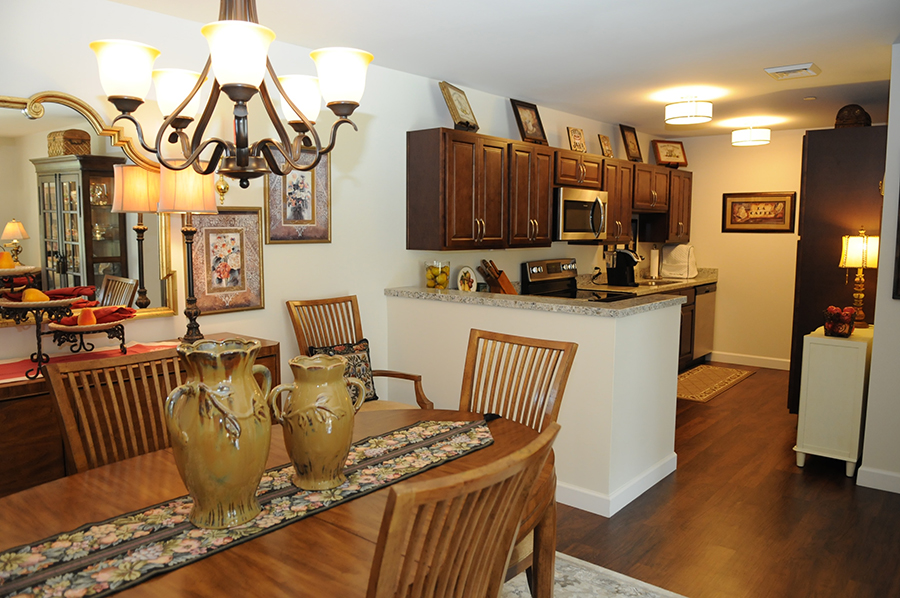 Cozy dining area connected to a modern kitchen.