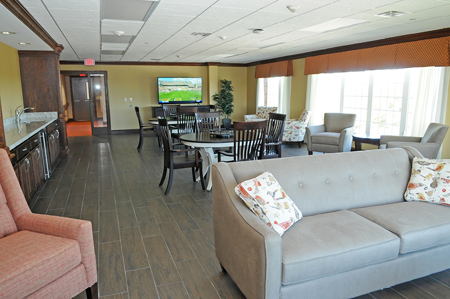 Modern lounge area with comfortable seating and a TV.