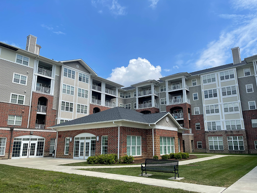Modern apartment building with a landscaped courtyard.