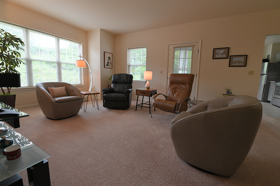 Cozy living room with comfortable seating and natural light.