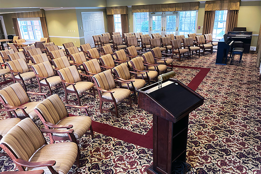 Empty seating arrangement in a spacious meeting room.