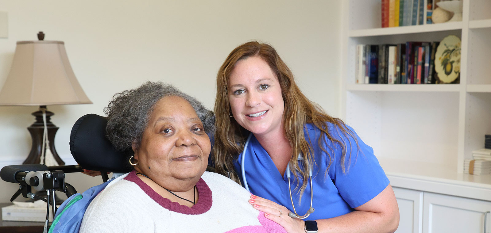 Caregiver and patient sharing a warm smile together.