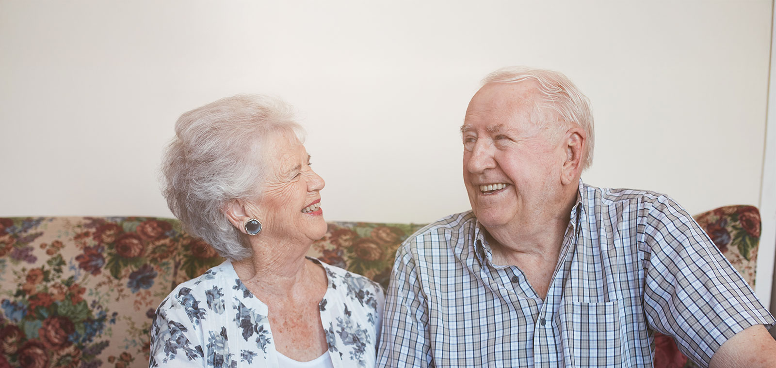 Smiling elderly couple enjoying each other's company.