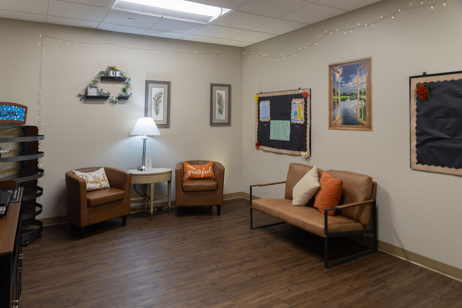 Cozy, well-decorated room with seating and soft lighting.