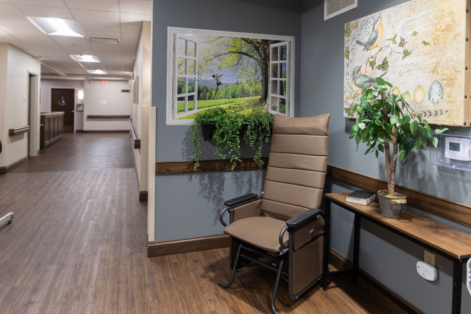 Cozy hallway corner with chair, plant, and nature mural.