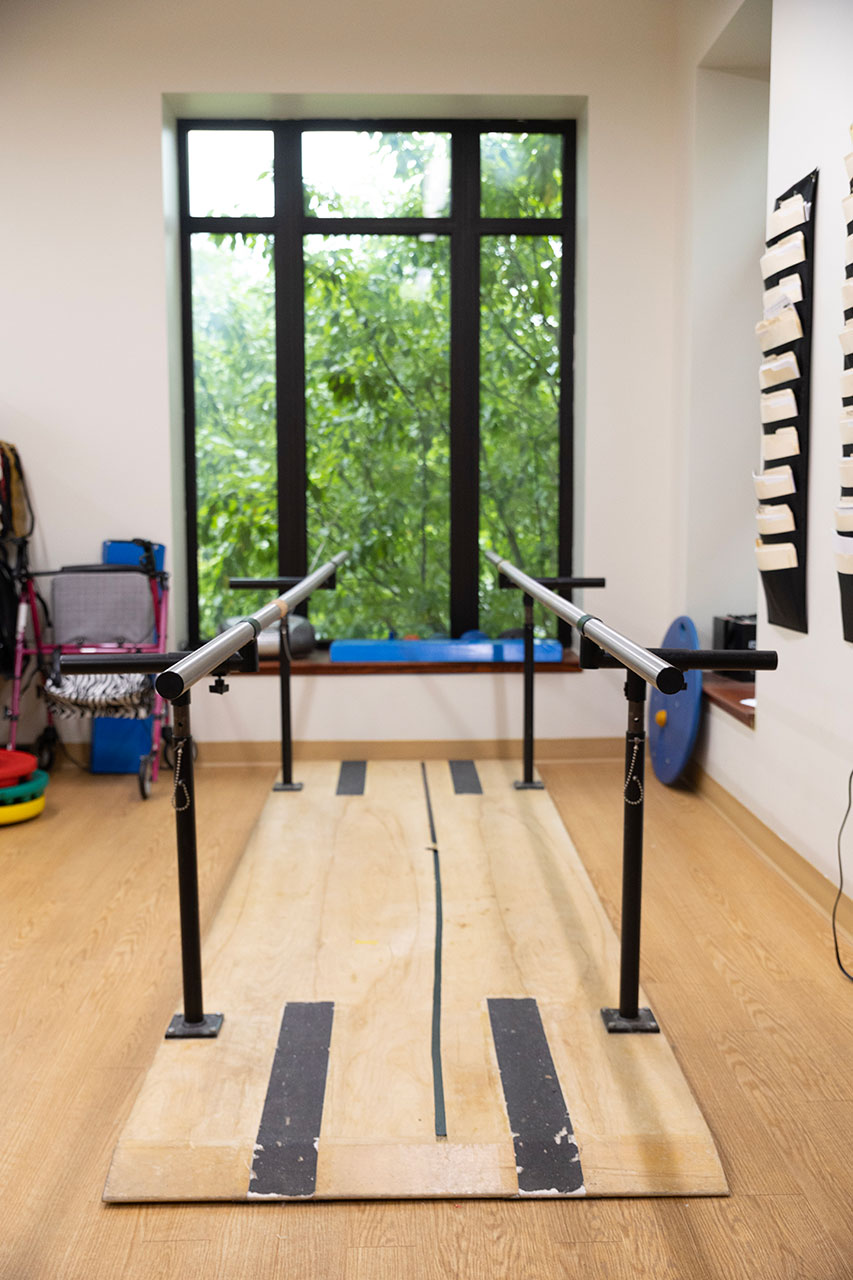 Gymnastics bars in a training space with natural light.