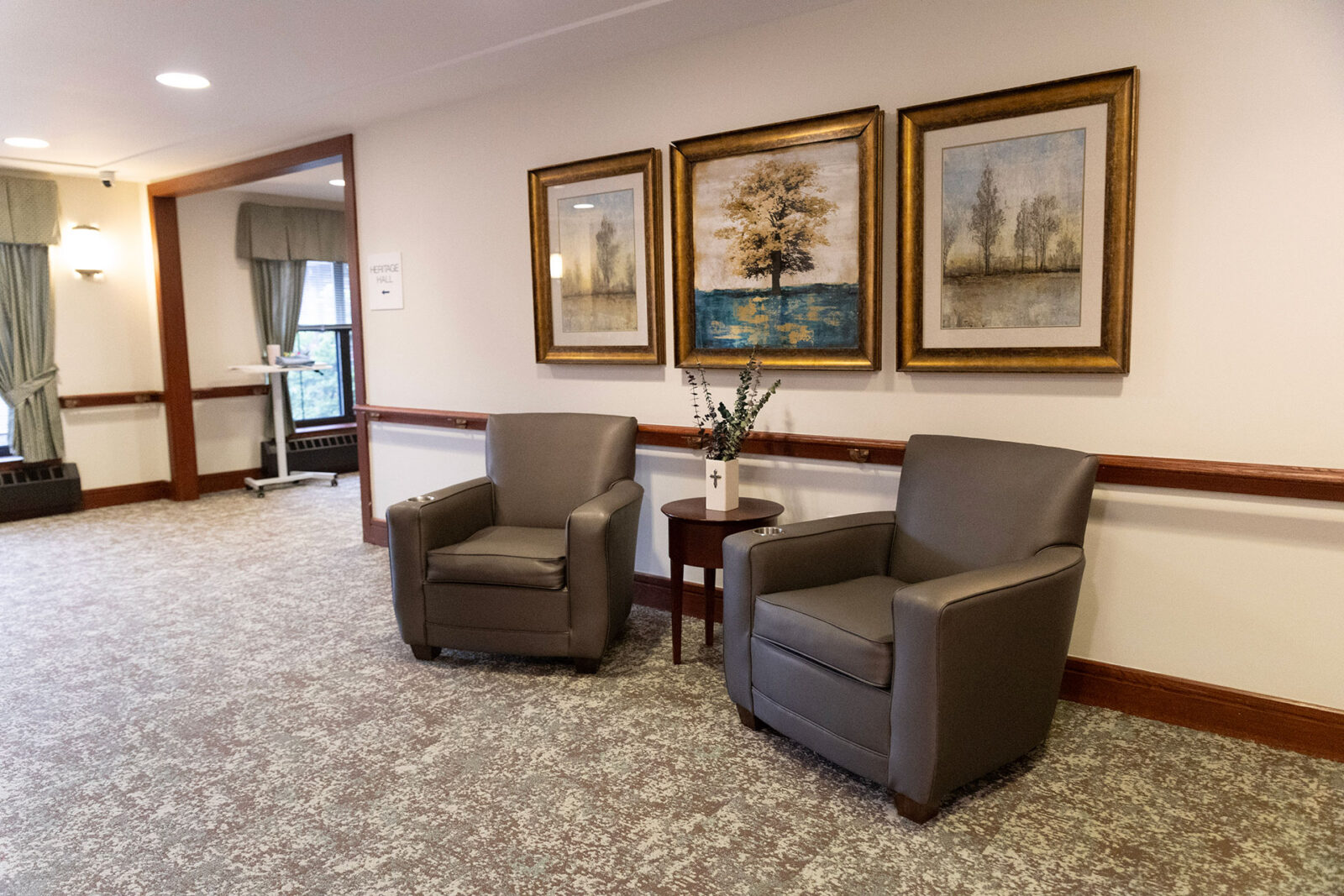 Cozy seating area with artwork and decorative touches.