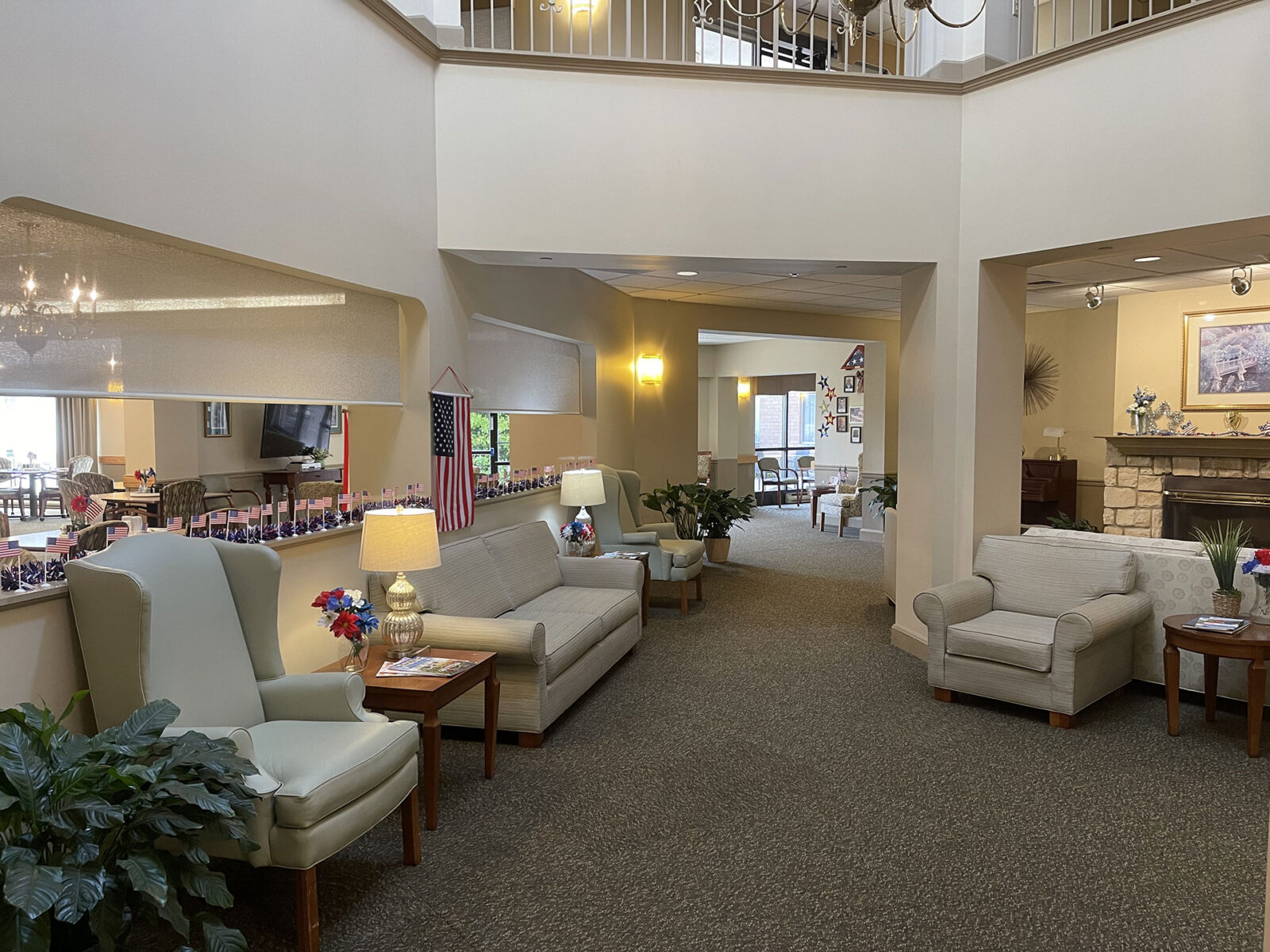 Cozy, well-lit lounge with comfortable seating and decorations.
