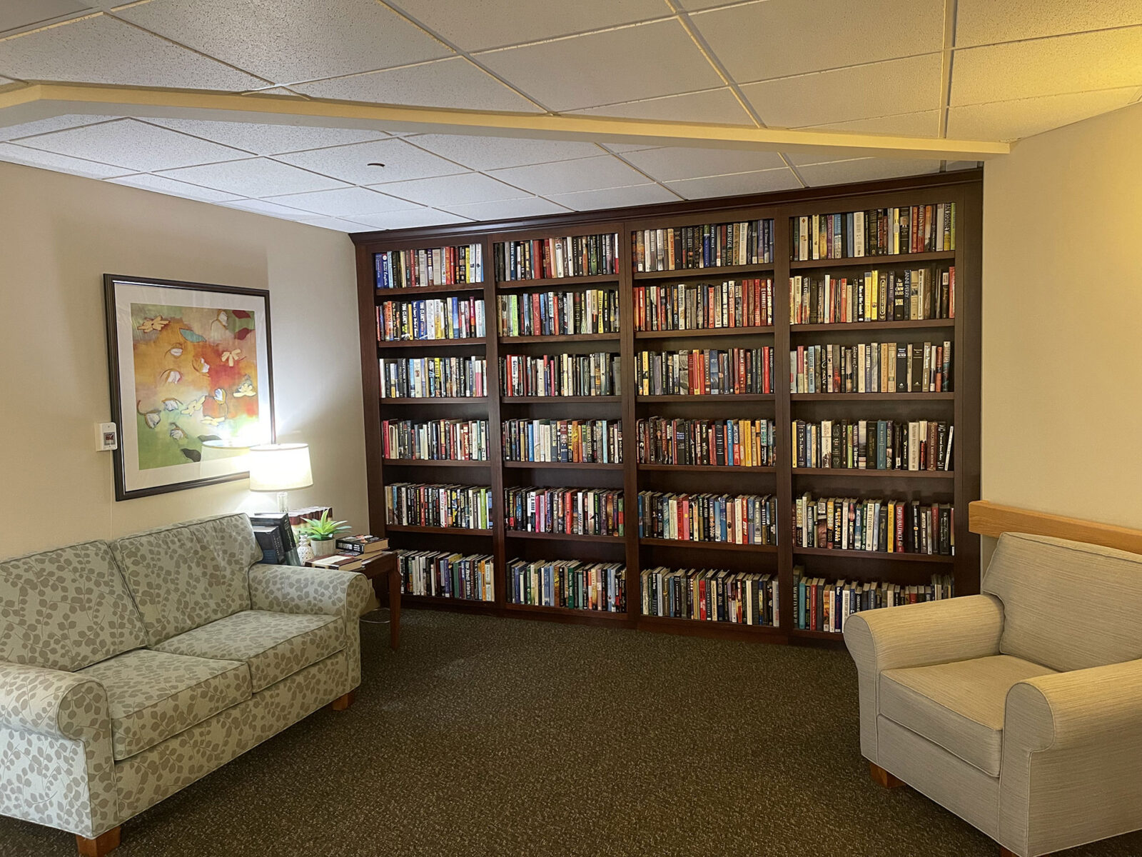 Cozy reading space with bookshelves and seating area.