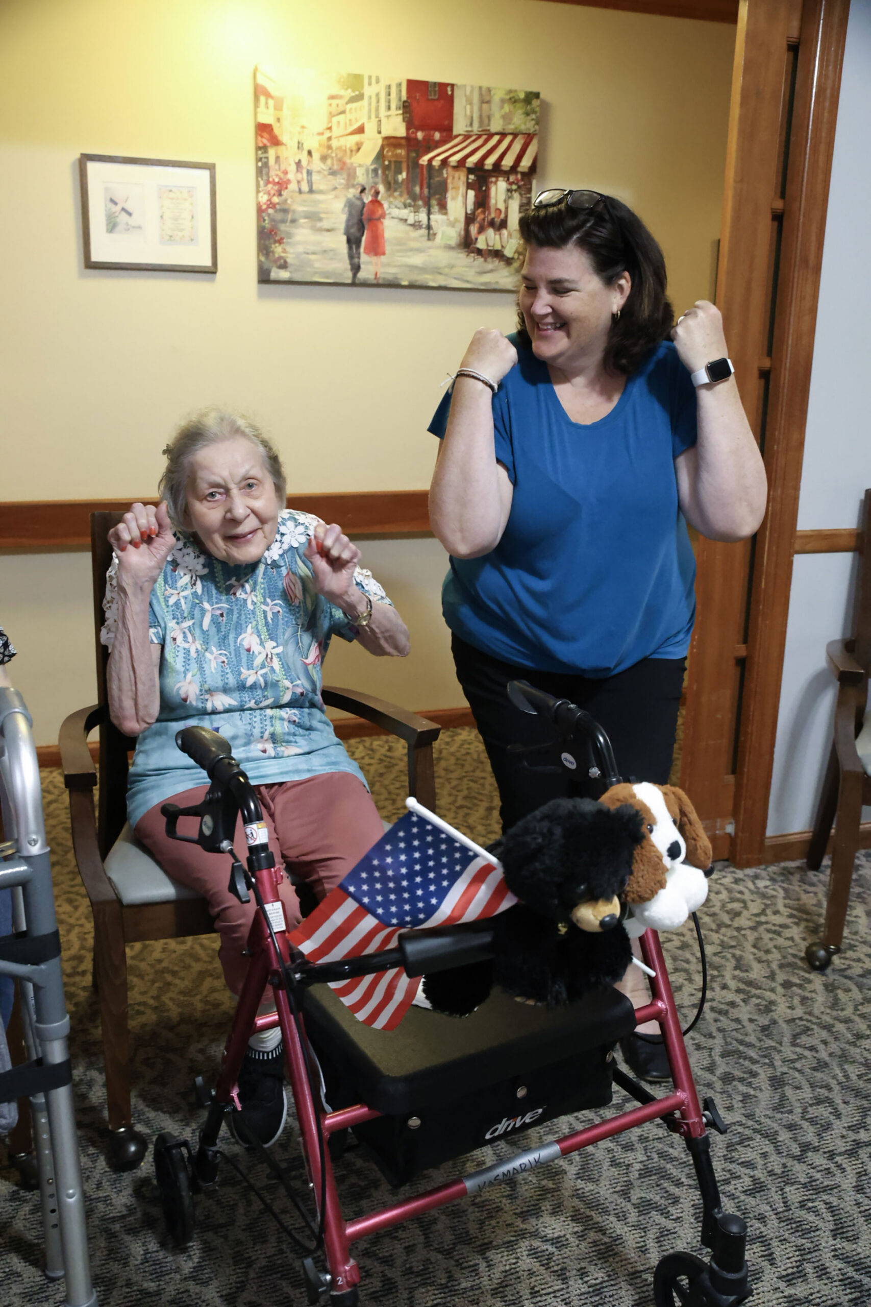 Two women enjoying a joyful moment together indoors.