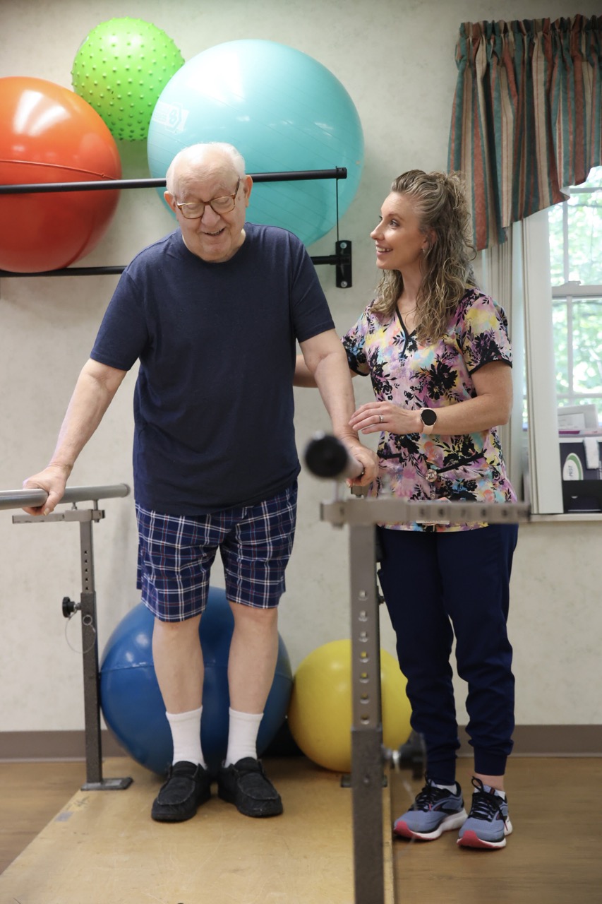 A therapist helps guide a patient at the Concordia at Cabot's Outpatient Therapy Unit.