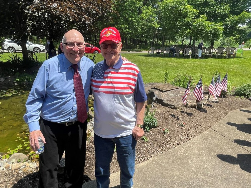 Concordia residents Rick and Herb in front of their Veteran Garden