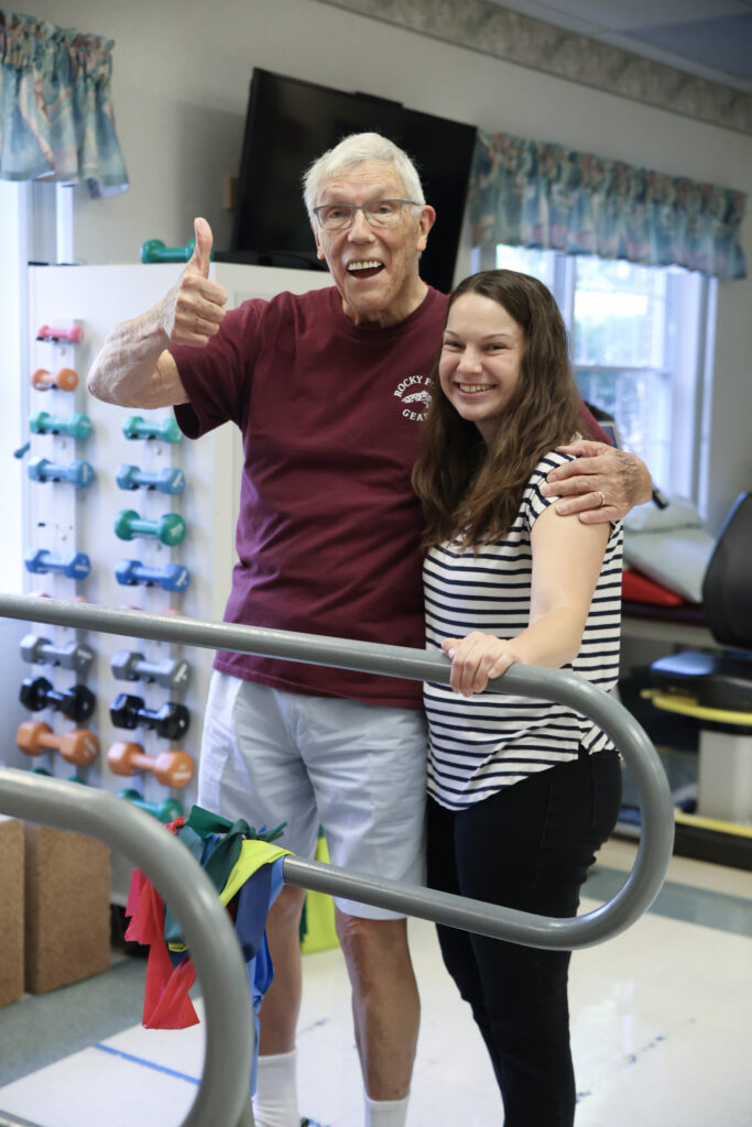 Jenn Anderson poses with an outpatient therapy rehab patient