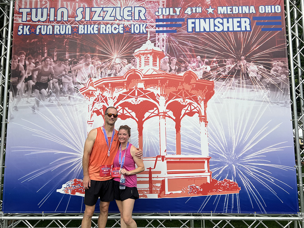 Amy Malone poses with her husband following a 5K.