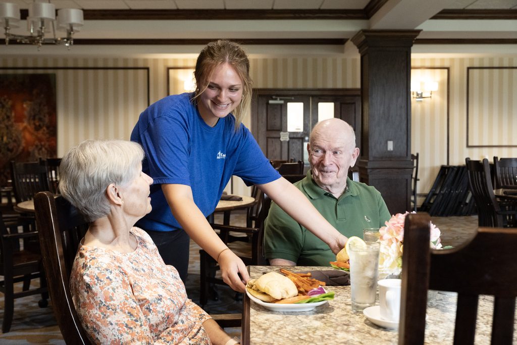 Highpointe at Rebecca retirement living residents being served a meal in the dining room