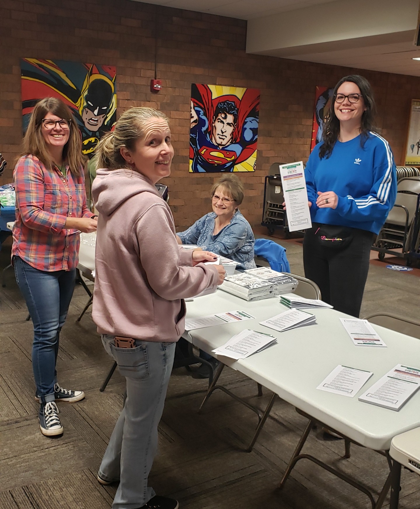 Sue Daniels and RAM volunteers prep community resource booklets at the Butler RAM clinic in 2023