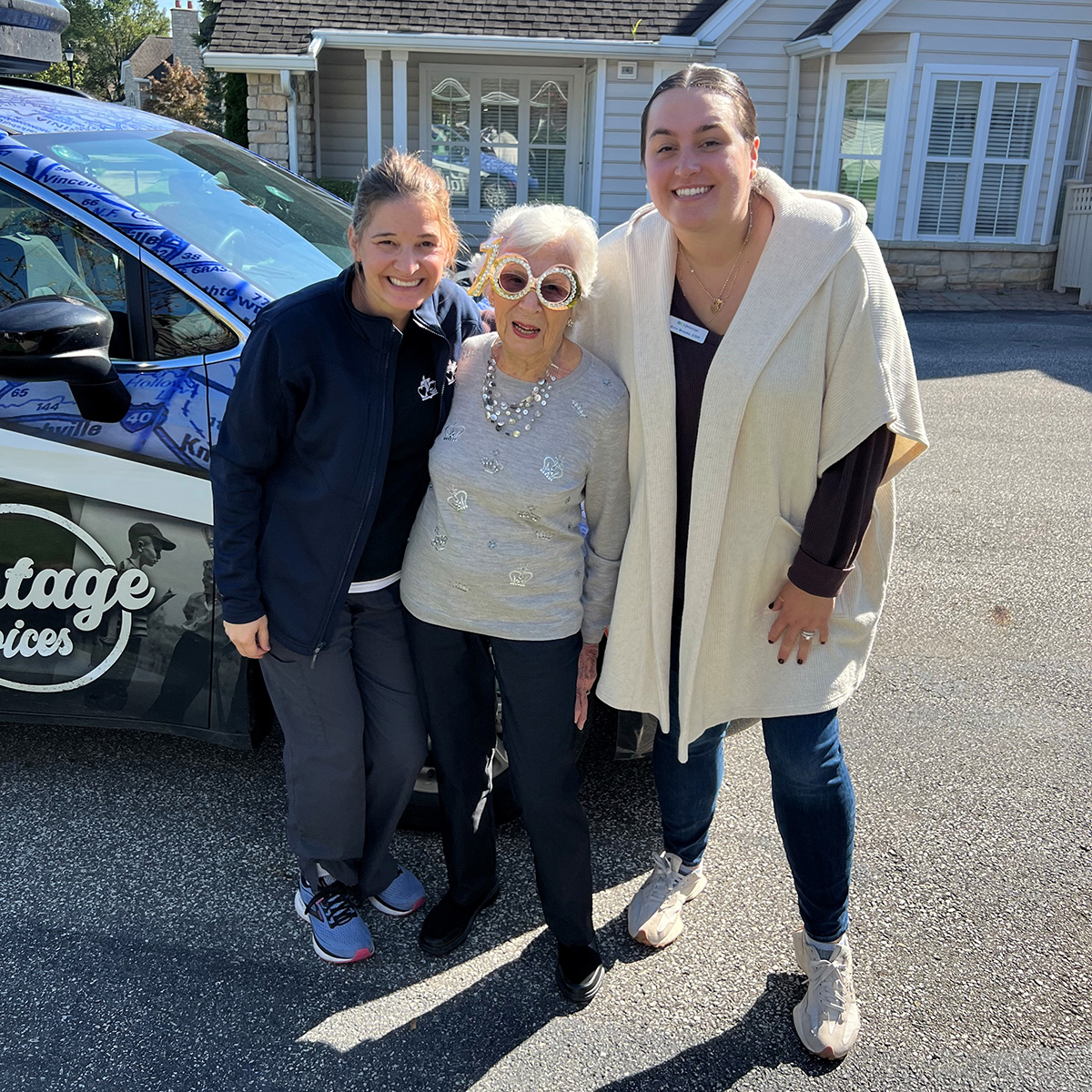 Amy Malone and a colleague pose with a resident.